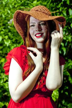 Young and happy woman wearing a hat