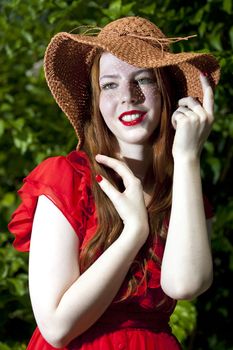 Young and happy woman wearing a hat