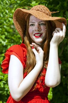 Young and happy woman wearing a hat