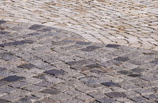 Stone paved park alley closeup as background