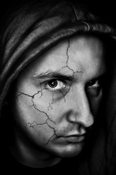 portrait of sinister,spooky looking man with cracked skin