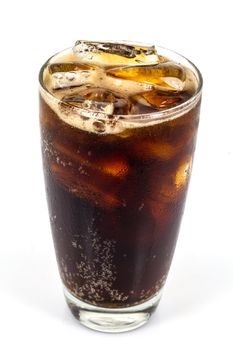 cola with ice on the grass