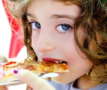 blue eyes child girl eating pizza slice hungry