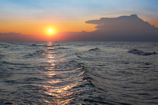 sunrise over sea with clouds