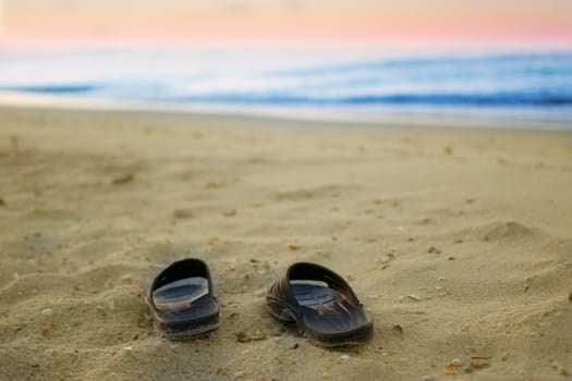 sneakers on a sandy beach 