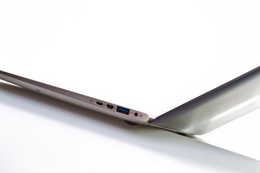 Angled view of an ultrathin modern laptop against white for abstract and background