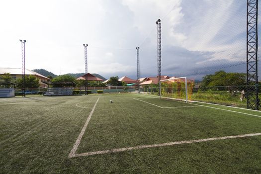 soccer football pitch with green artificial grass