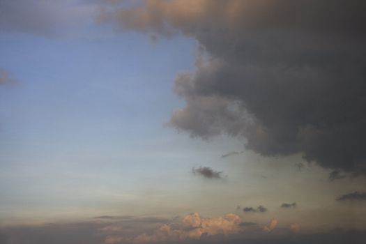 Blue sky with cloud during dusk.