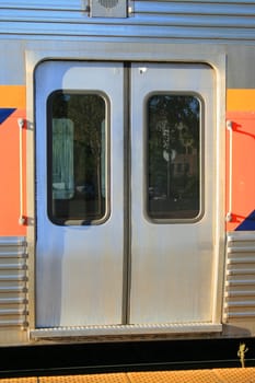 Close up of a passenger train entrance.
