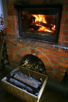 Interior with brick furnace and fire