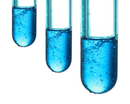 Test tubes with a dark blue liquid on a white background