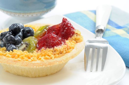 Delicious fruit tart with blueberries, kiwi and strawberries.