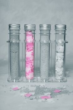 Bottles with salt for baths in a transparent support