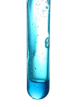 Test tube with a dark blue liquid on a white background