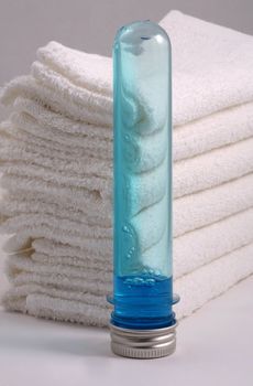 White towels and two bottles with shampoo
