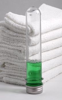 White towels and two bottles with shampoo