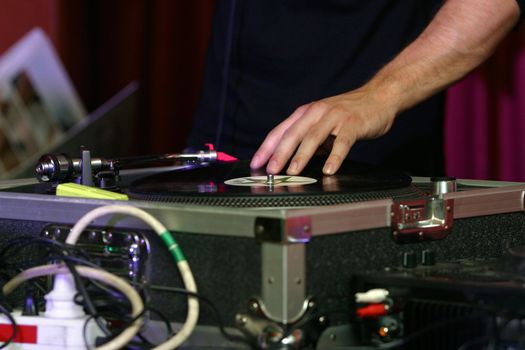 DJ turntable playing. DJ playing the music