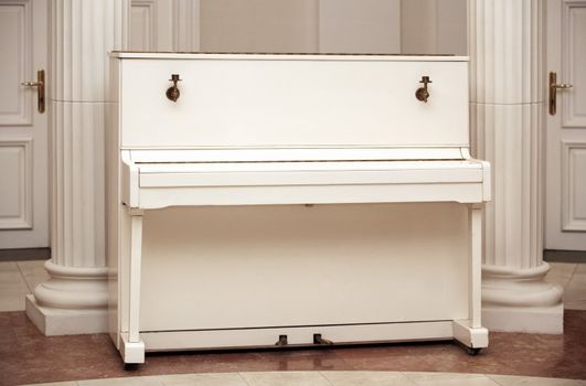 The white piano in an interior