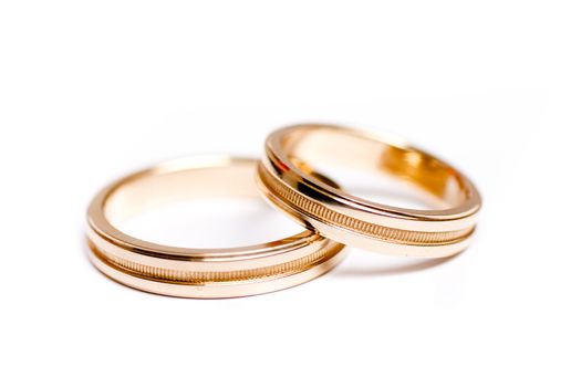 Pair of wedding bands isolated on white background, macro