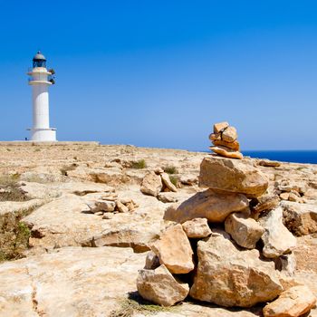 Barbaria formentera Lighthouse and make a wish stones mound