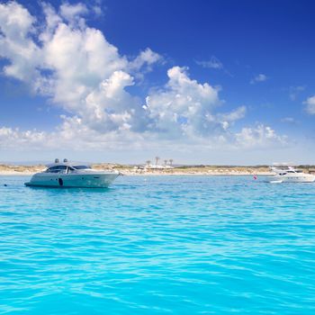 Anchored motorboats in Formentera Illetes beach near Ibiza