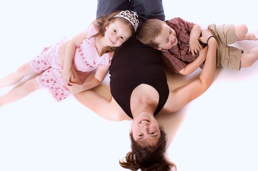 Mother, daughter and son playing and laughing (white background)