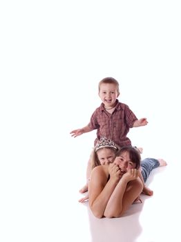 Mother, daughter and son playing and laughing (white background)