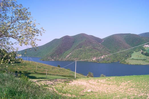 Panoramic sunset landscape lake in Italy and tree