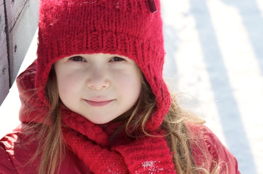 Cute little girl walking in the snow