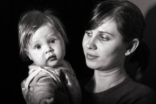 Black and white portrait mother with baby