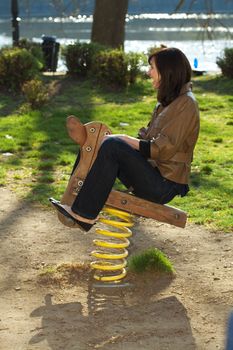 young woman in a baby swing