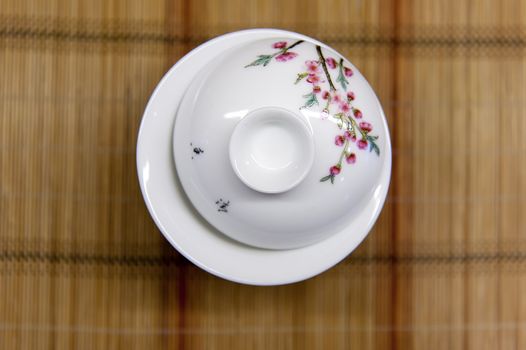 chinese teacup on straw mat