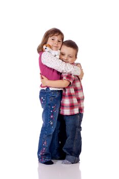 Cute little boy and girl hugging