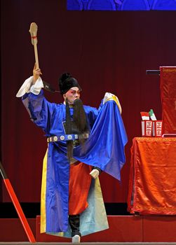 CHENGDU - JUN 5: chinese Sichuan opera performer make a show on stage to compete for awards in 25th Chinese Drama Plum Blossom Award competition at Chongzhou theater.Jun 5, 2011 in Chengdu, China.
Chinese Drama Plum Blossom Award is the highest theatrical award in China.