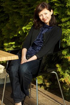 young woman sitting at a table in a cafe