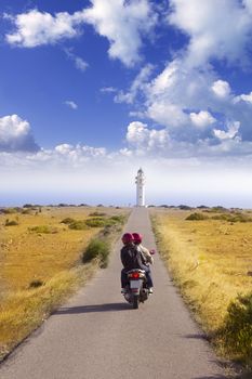 Barbaria cape formentera lighthouse road tourist couple in bike