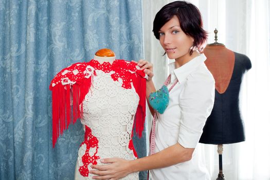 Dressmaker with mannequin as professional fashion designer