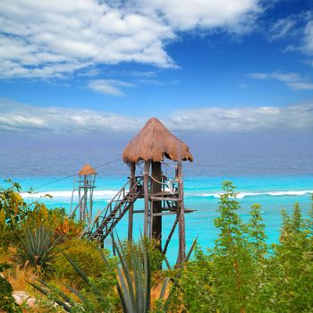 Caribbean zip line tyrolean turquoise sea in Mexico