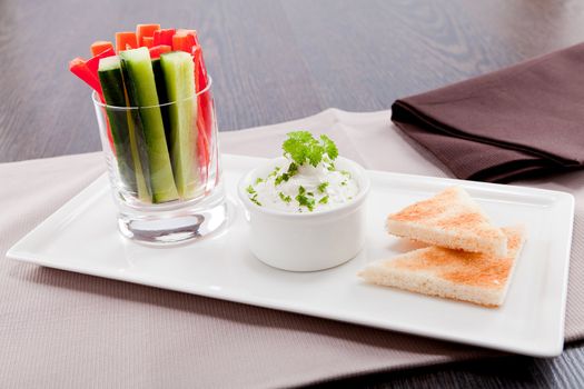 fresh vegetables snack and cream cheese dip with bread on plate