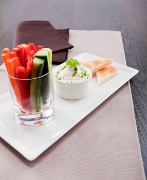 fresh vegetables snack and cream cheese dip with bread on plate