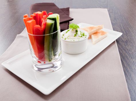 fresh vegetables snack and cream cheese dip with bread on plate