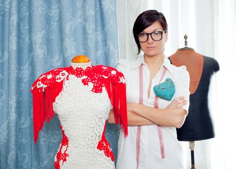 Dressmaker with mannequin as professional fashion designer