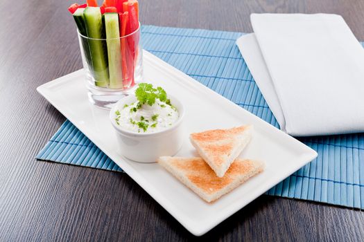 fresh vegetables snack and cream cheese dip with bread on plate