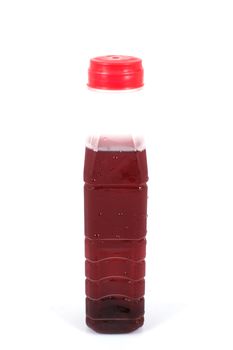 Roselle juice in plastic bottle on whiet background