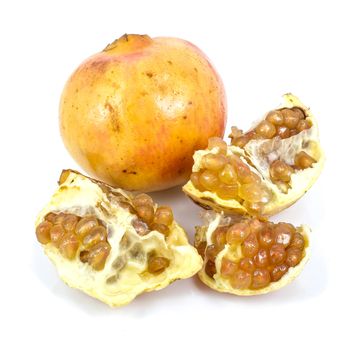 yellow pomegranate and its half  Isolated on a white background.