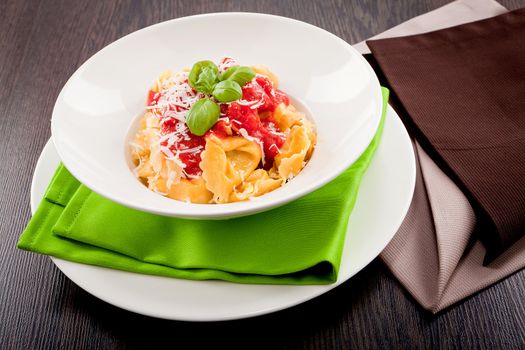 tasty fresh homemade ravioli with tomato sauce basil and parmesan