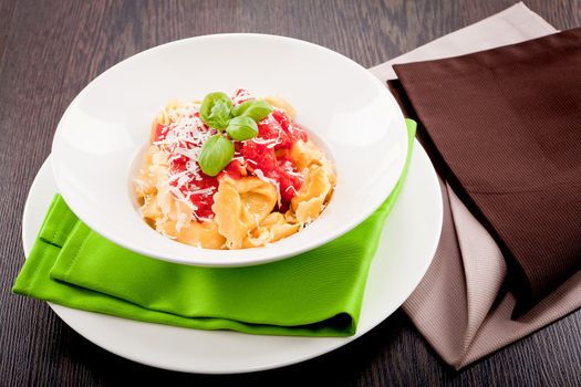 tasty fresh homemade ravioli with tomato sauce basil and parmesan