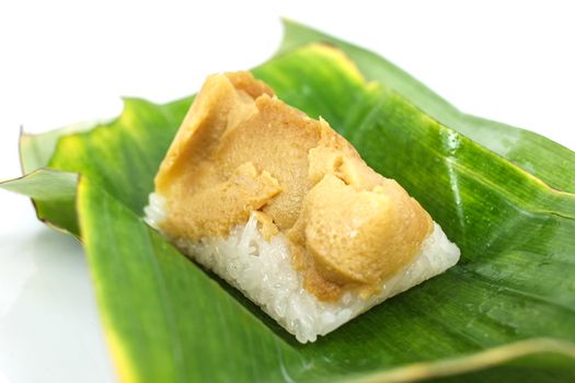 Thai dessert, Sticky rice with steamed custard, wrapped in banana leaves.