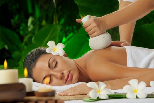 portrait of young beautiful woman in spa environment