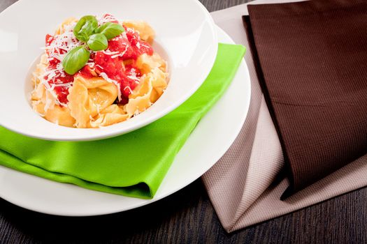 tasty fresh homemade ravioli with tomato sauce basil and parmesan